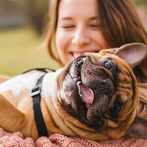 Woman & dog smiling